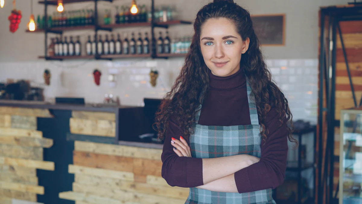 Smiling coffee shop owner standing behind the counter of her business